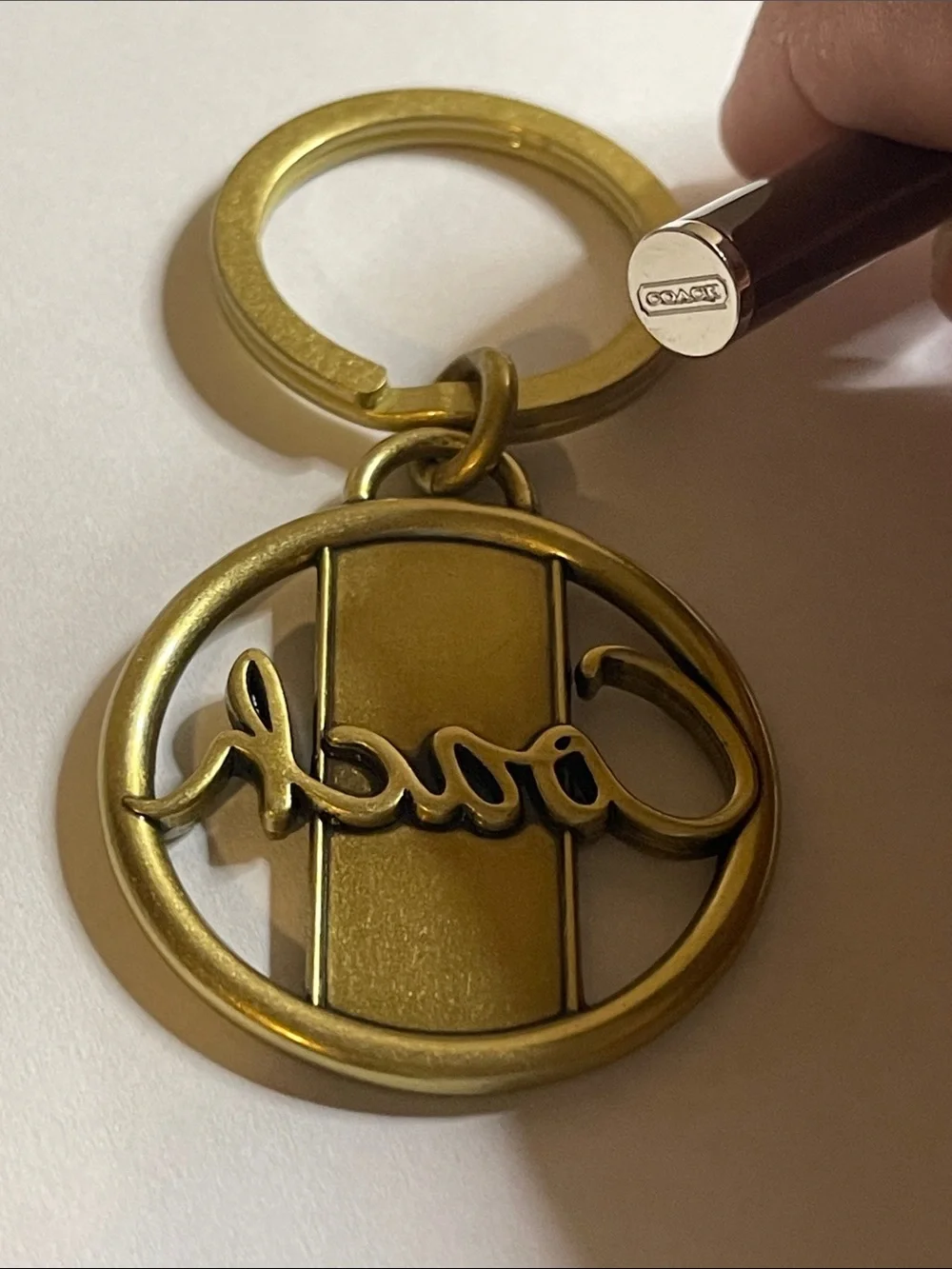 Coach Gold-Tone Circular Logo Keyring and Coach Pen